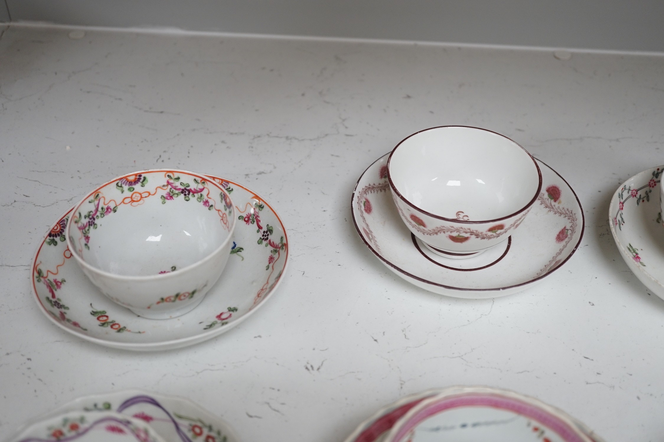 A quantity of Newhall teabowls and saucers and a pearlware tea bowl and saucer, c.1790-1800